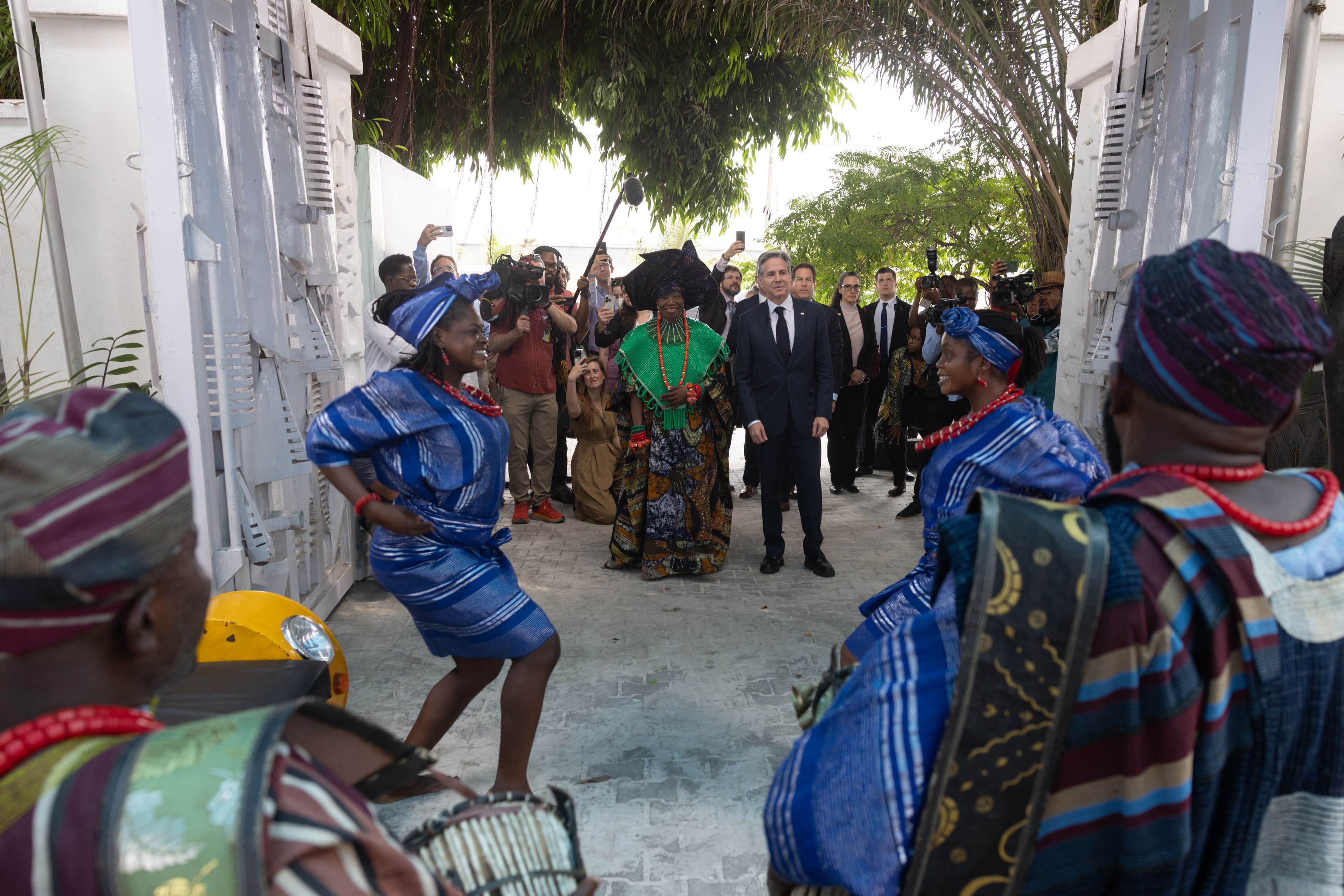 Traditional dancers and drummers greeting visitors at the gated entrance to Nike Art Gallery.